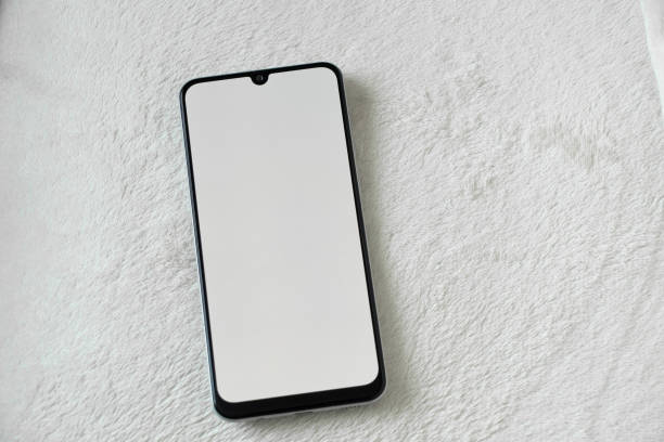 istock phone with a white screen lies on a white soft background close up 1497681318