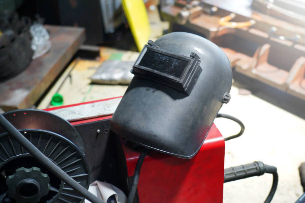 istock Welding masks in the welder's workshop. 1497681998