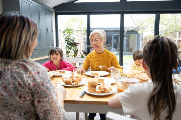 istock Children and adults interacting during weekend meal 1497682571