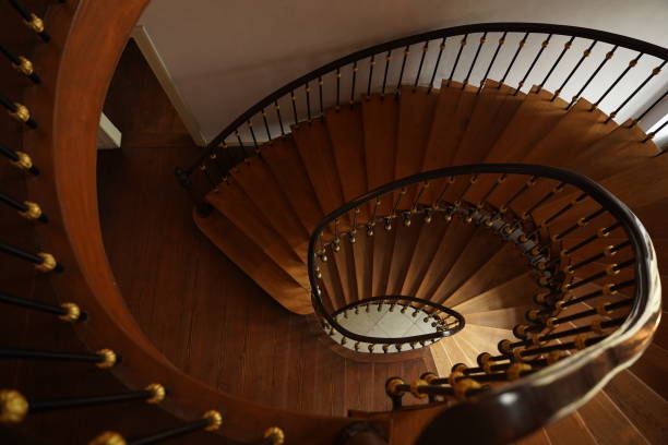 istock Spiral staircase with wooden railings. 1497682753