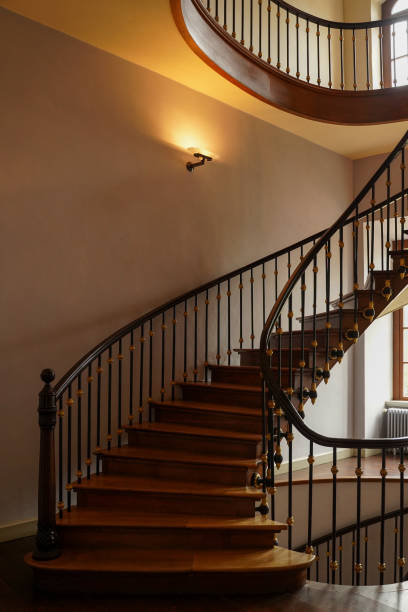 istock Spiral staircase with wooden railings. 1497682788