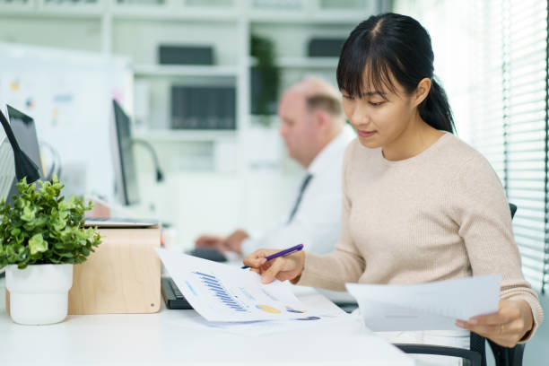 istock Businesspeople working in the office. 1497685943