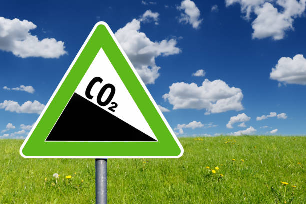 CO2 Emission Reduction Sign Green Triangular Shape stock photo