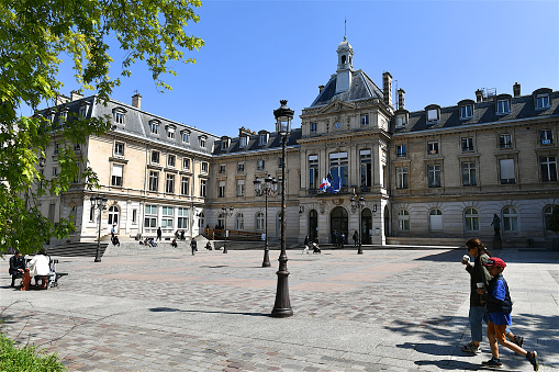 Paris, France-05 17 2023: People passing in front of the Paris 15 th arrondissement Town Hall building , France.