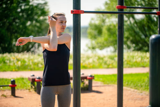 istock Stretching legs at outdoors sports ground. Getting ready to exercise. 1497688319