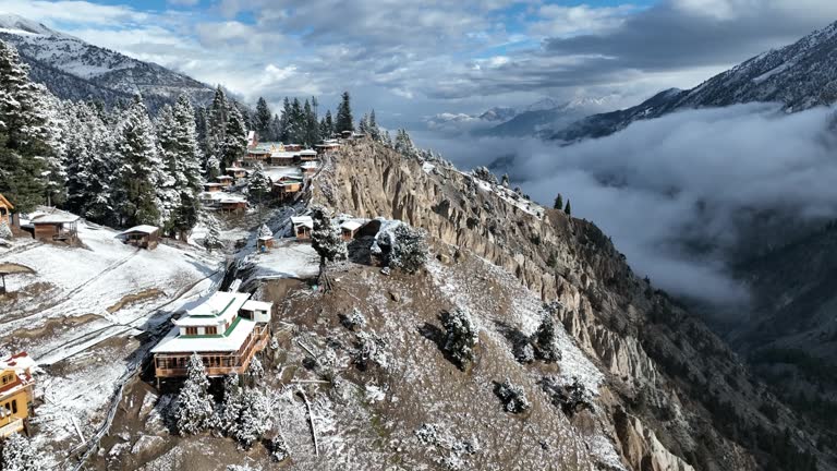 Aerial drone view Sunrise Scenic with morning fog and snow at fairy meadows national park with Rakhiot Glacier in Nanga Parbat mountains, Karakoram Range, Himalayas Mountain, Northern of Pakistan