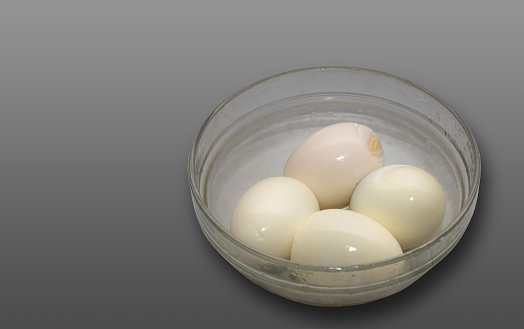 Closeup Image Of Boiled Eggs In Glass Bowl in Isolated Background