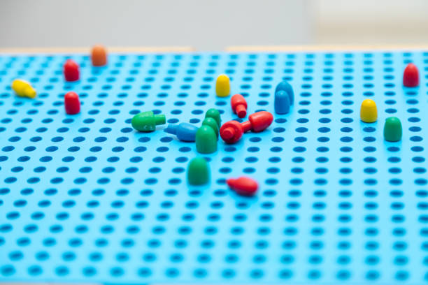 istock Close up toddler playing with montessori peg board 1497693189