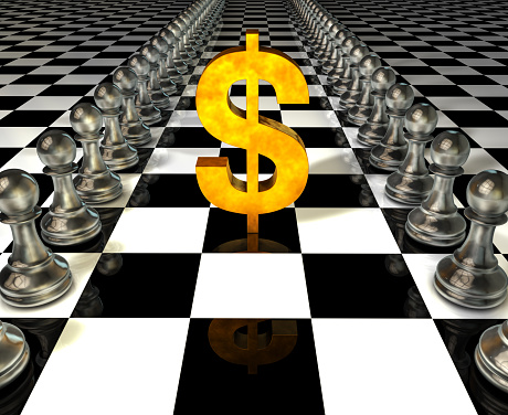Dollar symbol and chess pieces