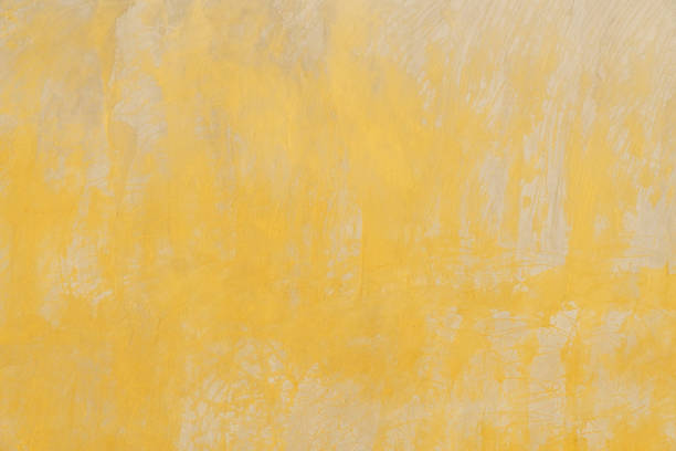 istock Yellow wall concrete texture, Cement vintage wallpaper background 1497699231