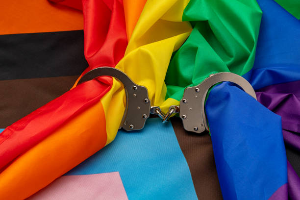 Rainbow pride flag and gavel. LGBTQ+ discrimination, legislation, and gay rights concept.