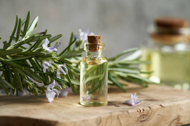 istock A bottle of rosemary essential oil on a table 1497700220