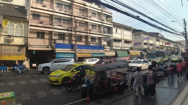 stock video thailand bangkok streetlife cars tuktuks