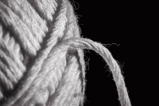 istock texture of a bergue-coloured polyester yarn spool 1497702518