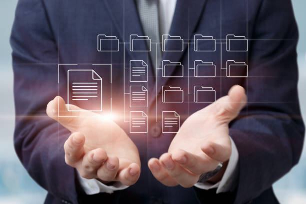 Businessman supports file archive . Businessman supports file archive on the virtual computer screen. organisation technics stock pictures, royalty-free photos & images