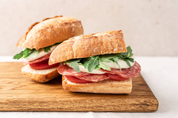 istock Picnic sandwich on wooden board close up view 1497702624