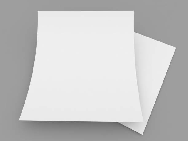 istock Two curved sheets of A4 paper on a gray background. 1497704260