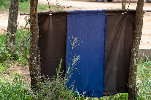 Blue and black flag, intented for tsetse fly pest prevention, in Tarangire National Park Tanzania