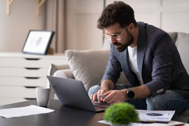 istock Handsome businessman working in Home office. 1497707310