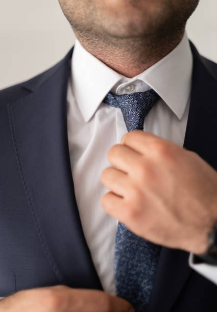 Detail of the lilac tie and blue button down shirt, isolated on white background. Convert from RAW. Nikon D300, Nikkor 105mm f/2.8G ED.