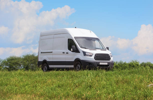 istock Minivan Moves on Country Road 1497709609