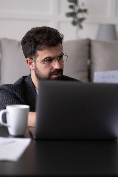 istock Handsome businessman working in Home office. 1497709700