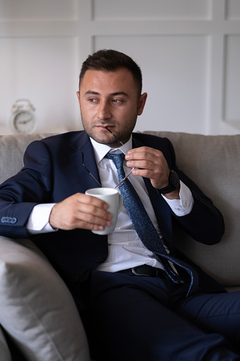 Thoughtful man enjoying a relaxing coffee