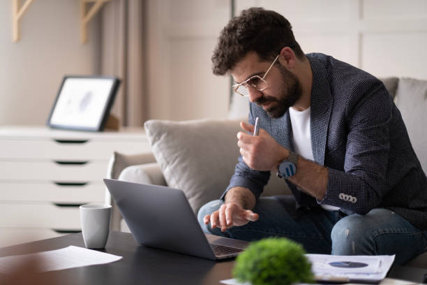 istock Handsome businessman working in Home office. 1497712289