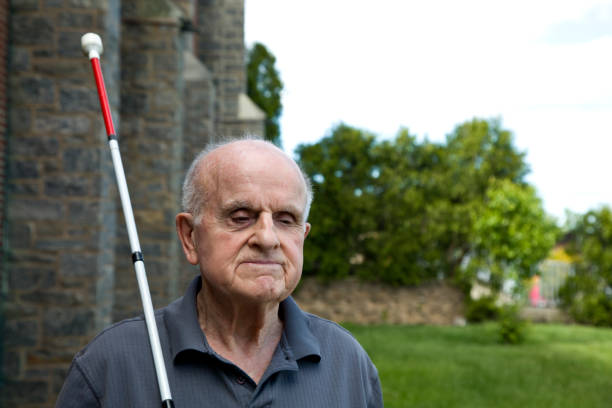 istock Blind man with a walking stick outdoors 1497712317