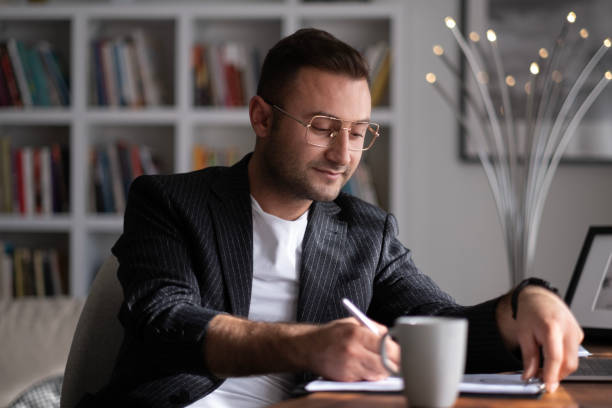 istock Handsome businessman working in Home office. 1497712400