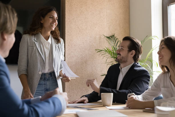istock Diverse businesspeople solve business gathered in board room 1497712510