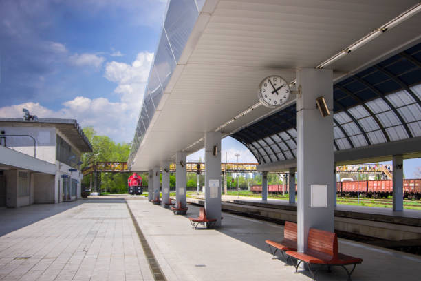 Railway station in Chisinau in Moldova. View of the platform with benches for waiting for the train under the clock.