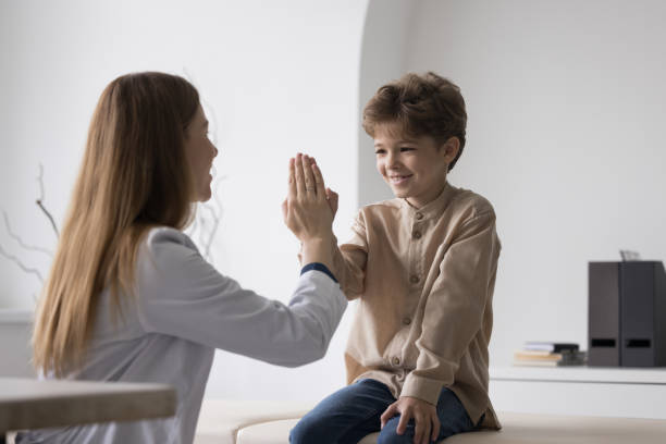 istock Family practitioner woman clapping hands with healthy child 1497725116