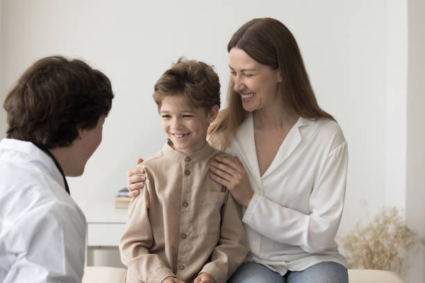 istock Cheerful boy and happy mom visiting pediatrician man for checkup 1497725135