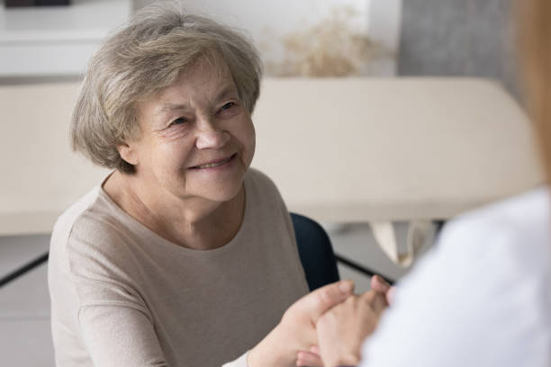 istock Positive optimistic older 80s lady visiting practitioner, consulting doctor 1497725213