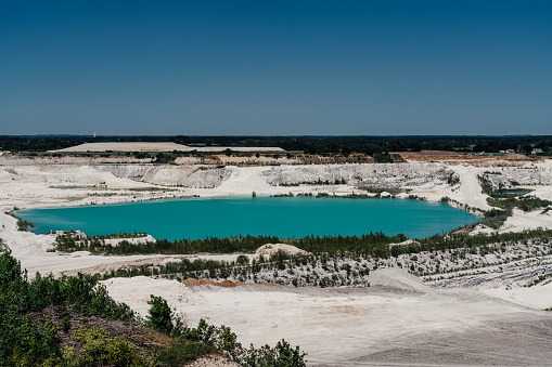 Lanark County, Canada - September 2, 2012: A pickup truck drives through Tatlock Quarry in Lanark County, Ontario. This open pit mine is the largest calcium-carbonate quarry in Canada.