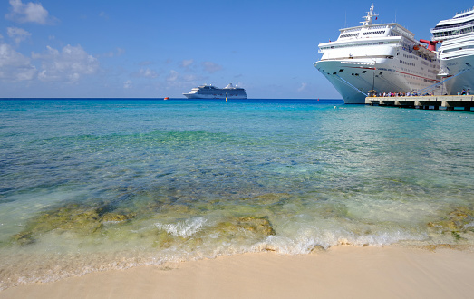 Grand Turk, Turks and Caicos — December 7, 2016: Cruise ships docked on pier in Caribbean Sea.