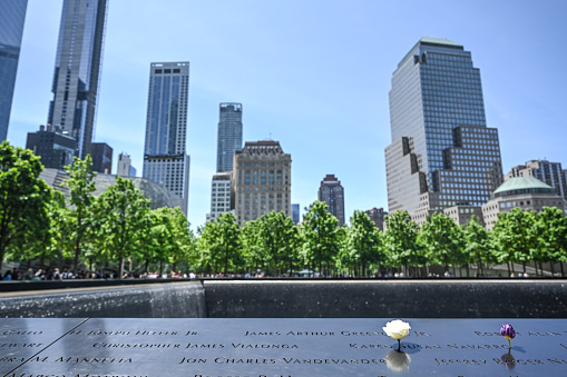 World Trade Center 9/11 memorial in New York City. Photographed on a clear sky summer day on 5/27/23