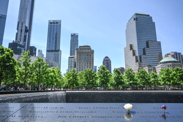 World Trade Center Memorial World Trade Center 9/11 memorial in New York City. Photographed on a clear sky summer day on 5/27/23 to the struggle against world terrorism statue photos stock pictures, royalty-free photos & images