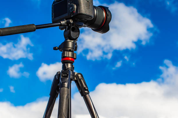 istock Camera equipment on tripod setup taking photographs of dramatic mountain landscape 1497731801