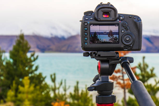 istock Camera equipment on tripod setup taking photographs of dramatic mountain landscape 1497731875