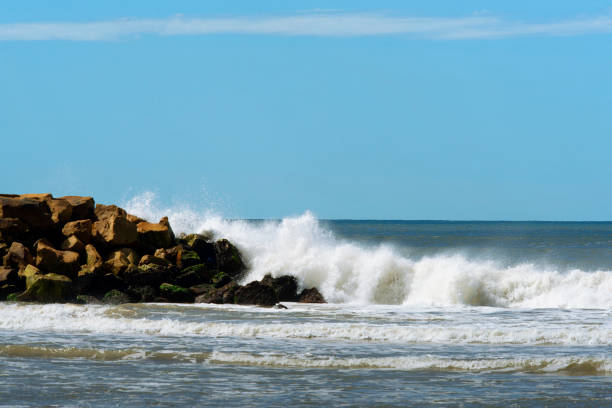 istock Sea and blue sky  Waves against rocks 1497733365