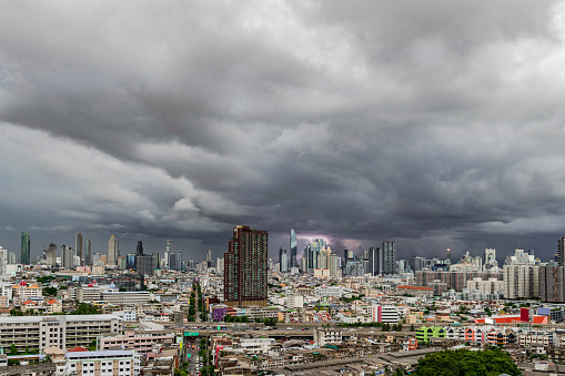 Menacing storm above Bangkok City Life background