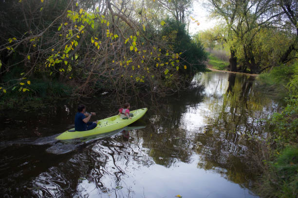 father and son in a kayak
