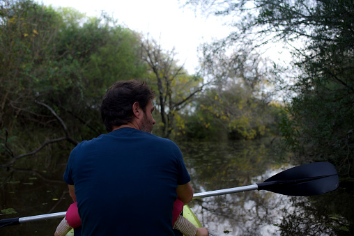 father and son in a kayak