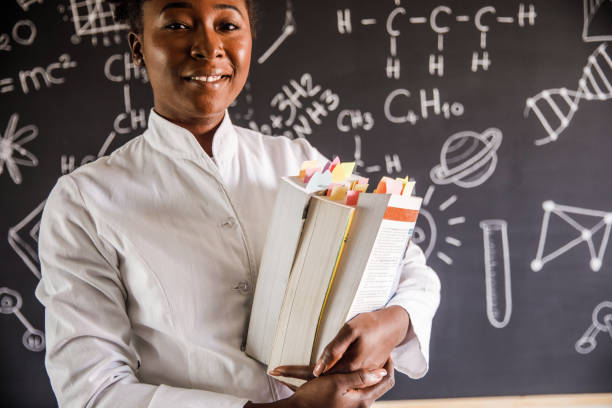 Young female teacher teaching a class at school