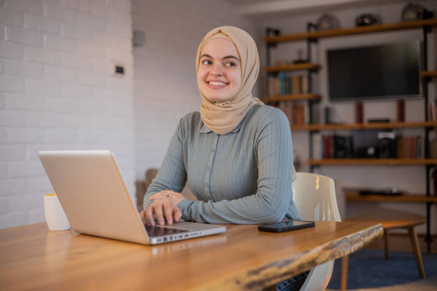 istock Young fashionable woman working at home 1497740964