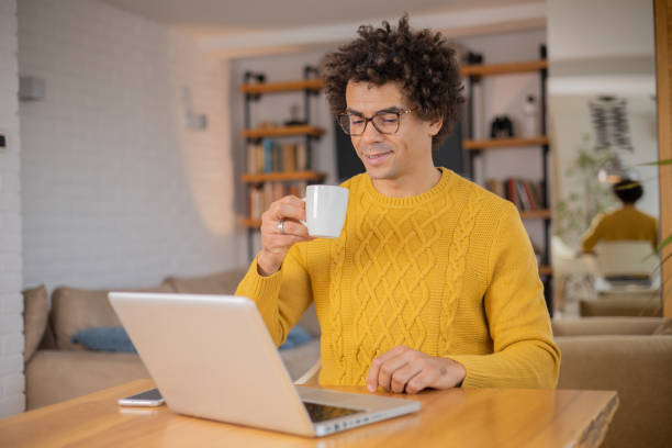 istock Young fashionable man working at home 1497741079