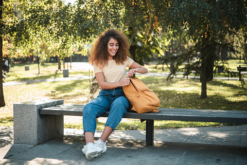 Portrait of a beautiful young woman enjoying in the park