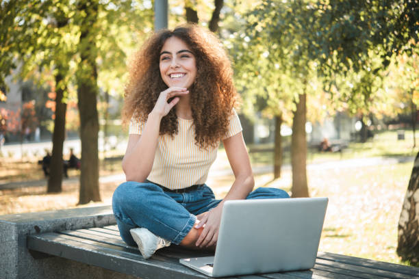 istock Beautiful girl freelancing from the park 1497741306